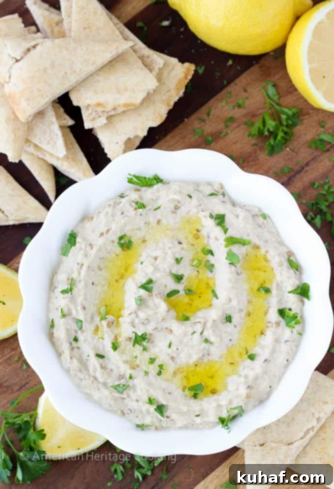 Baba Ganoush 3 Another close-up shot of the Baba Ganoush, highlighting its creamy texture and inviting appearance, garnished with herbs.