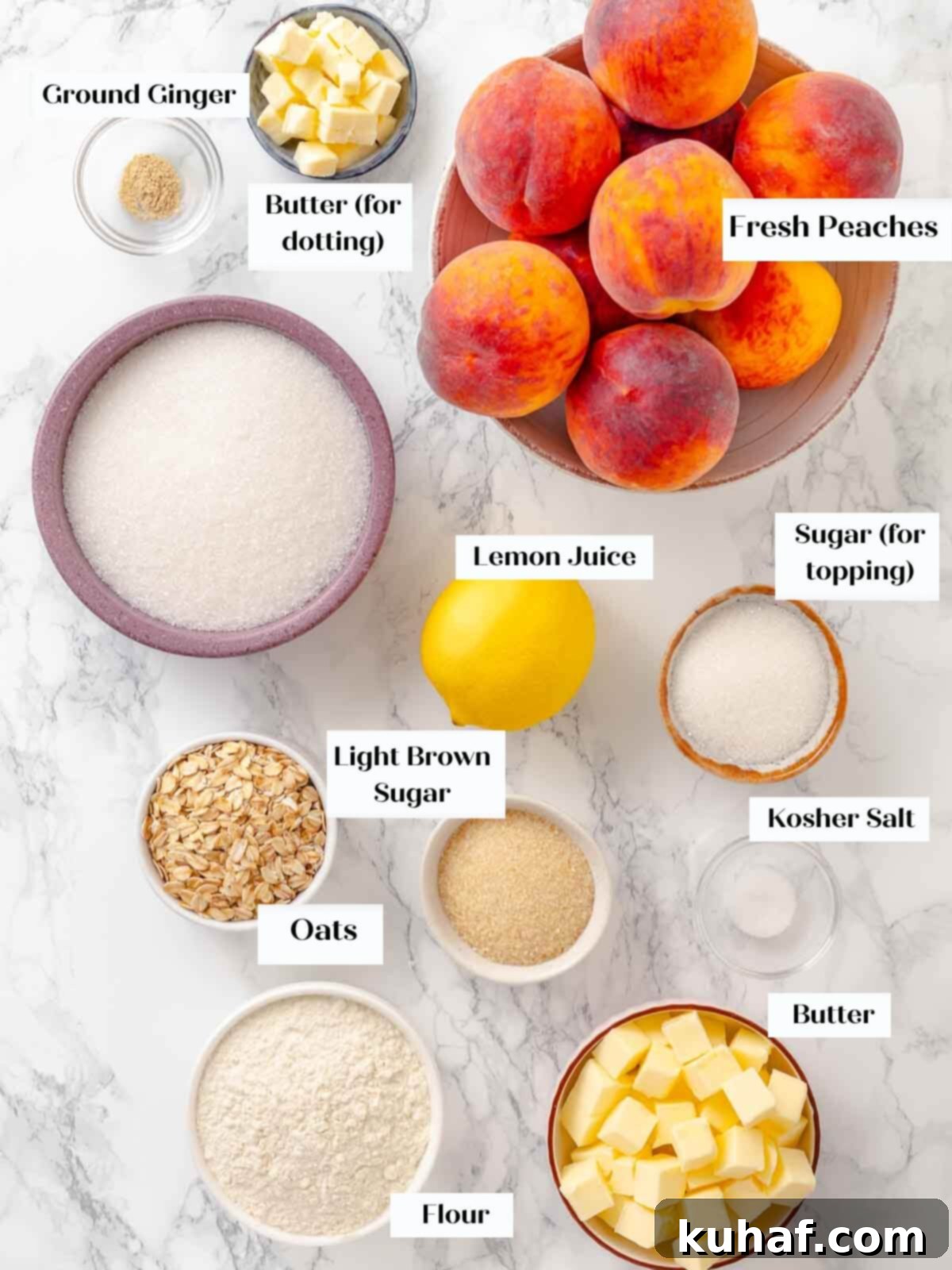 Ingredients for peach crisp laid out on a marble countertop, including peaches and streusel topping components.