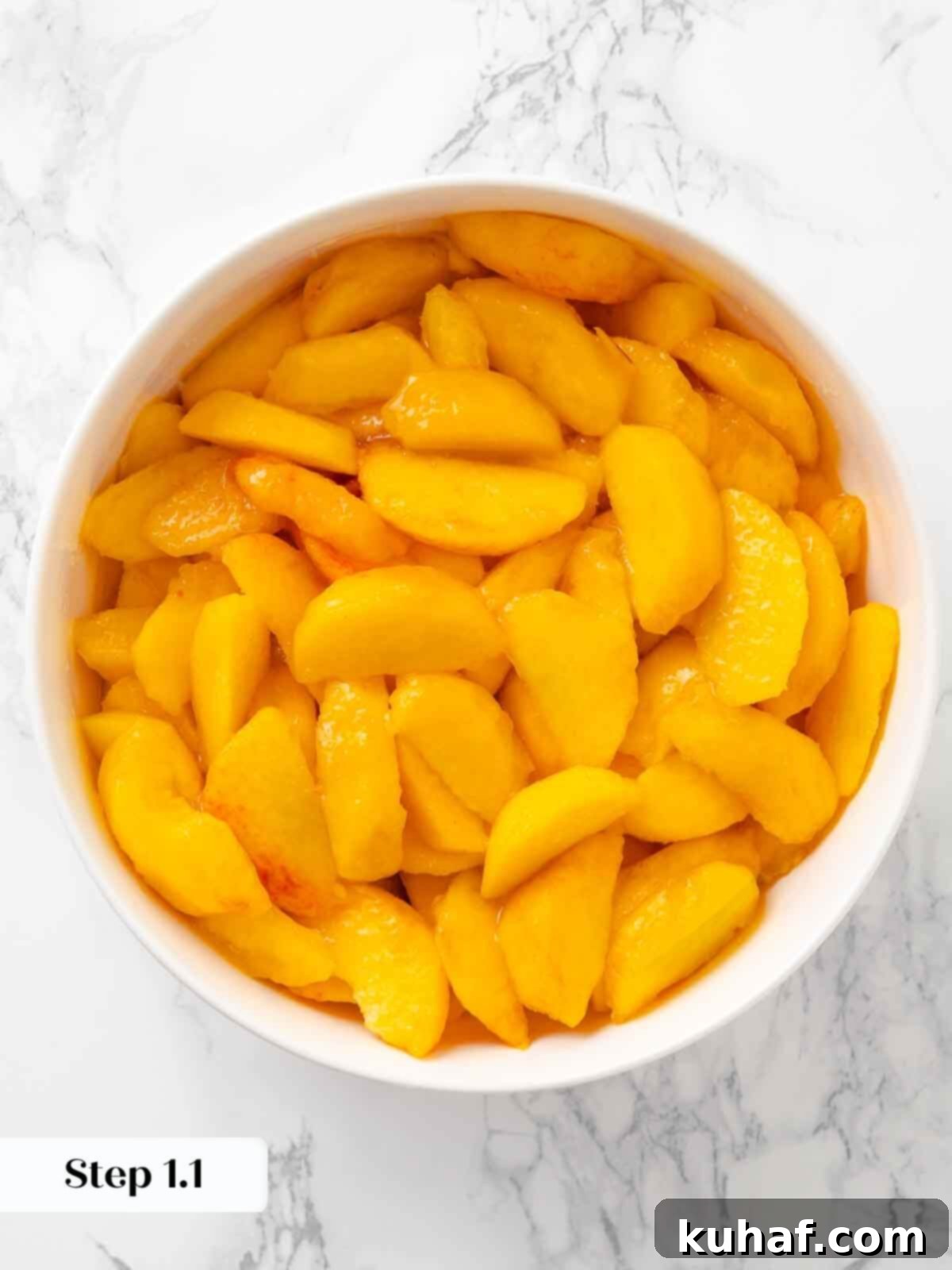 Freshly sliced peaches, prepped for making peach crisp.