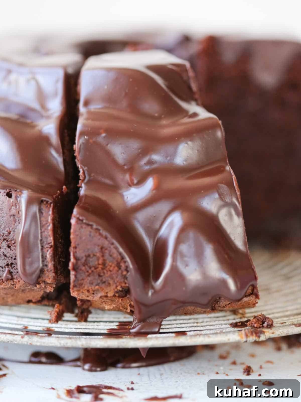ganache covered chocolate bundt cake slice viewed from the back.