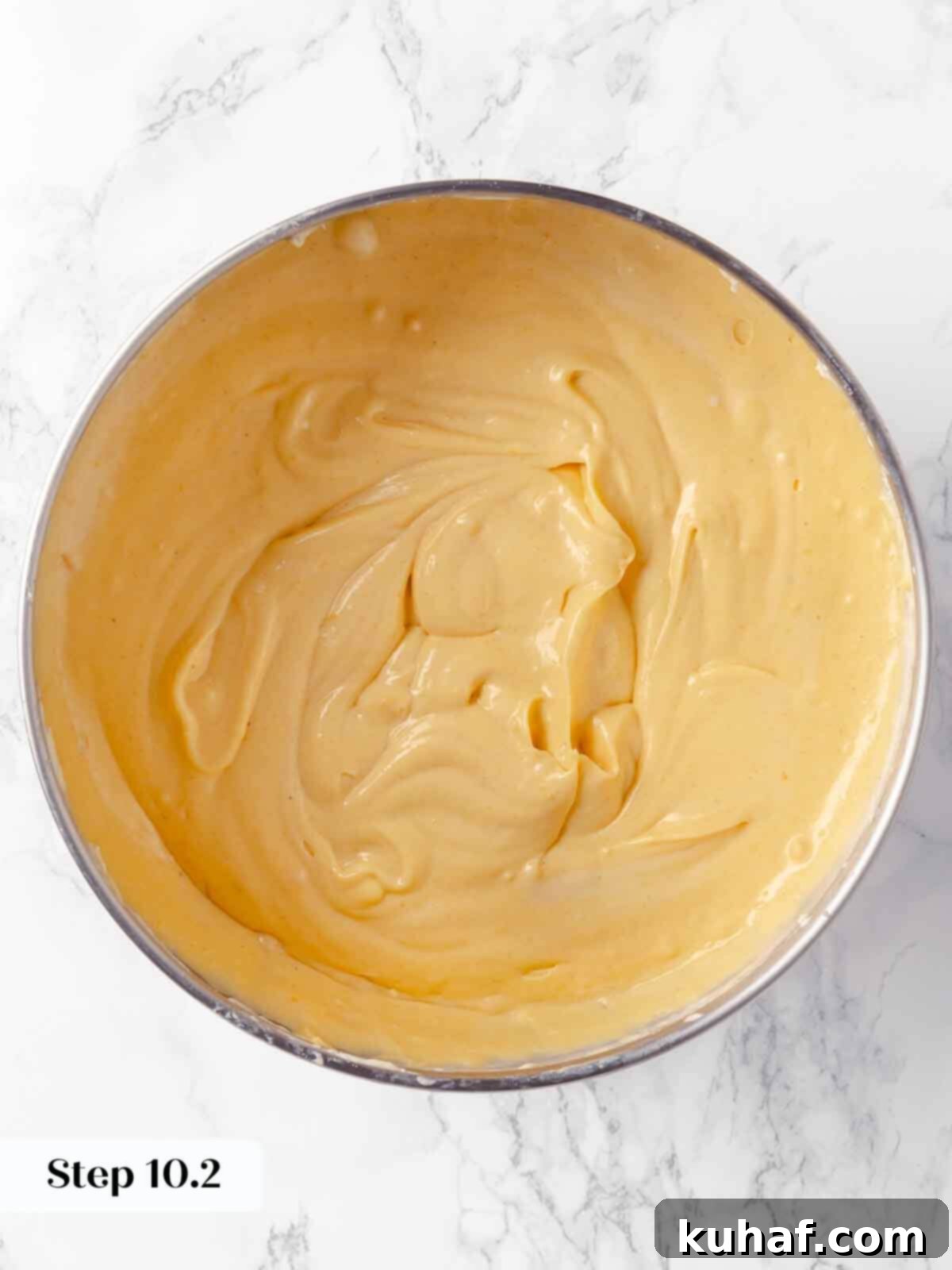 Decadent Pumpkin Cheesecake 16 The fully blended pumpkin cheesecake batter, smooth and ready for baking.