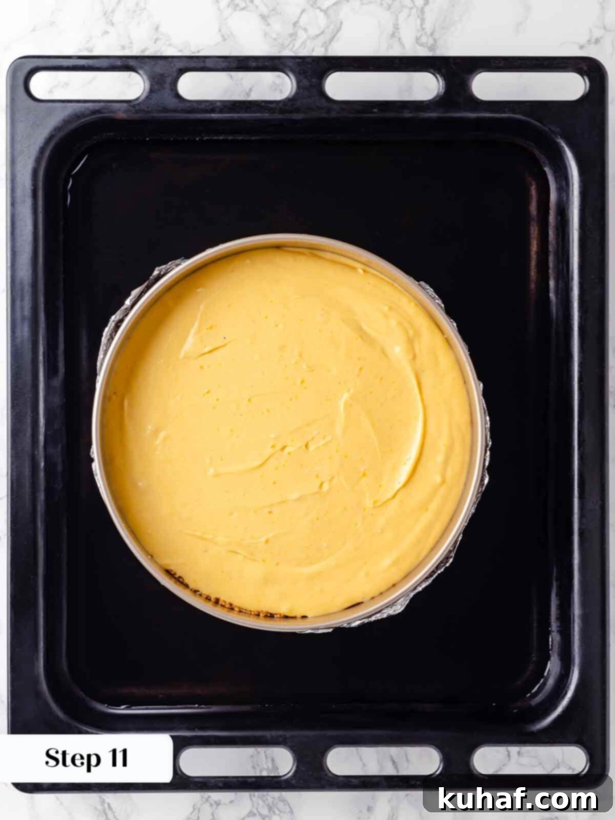 Decadent Pumpkin Cheesecake 17 The springform pan gently nested within a larger roasting pan for the water bath method.