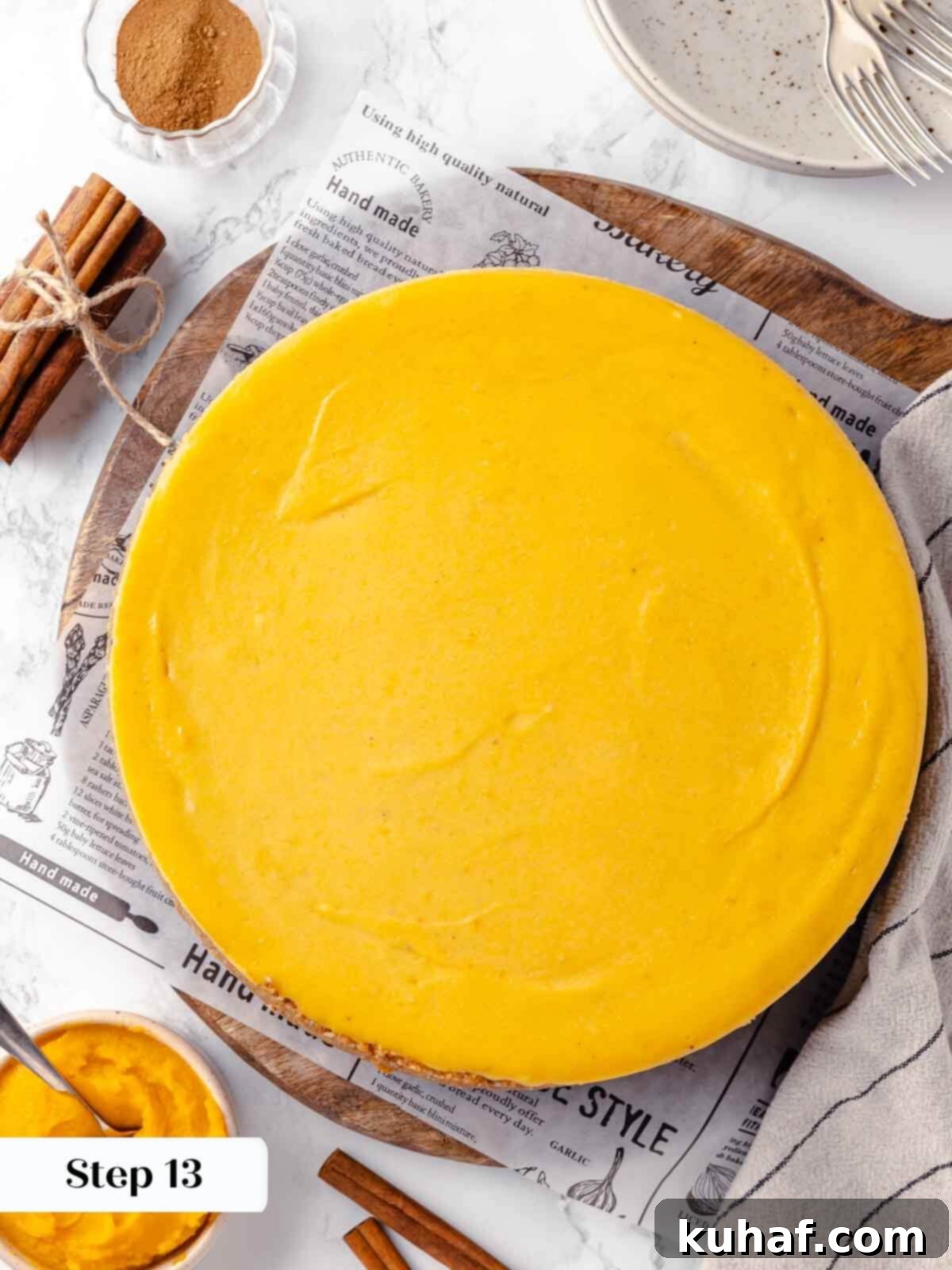 Decadent Pumpkin Cheesecake 19 The pumpkin cheesecake cooling on a wire rack, allowing it to gradually reach room temperature.