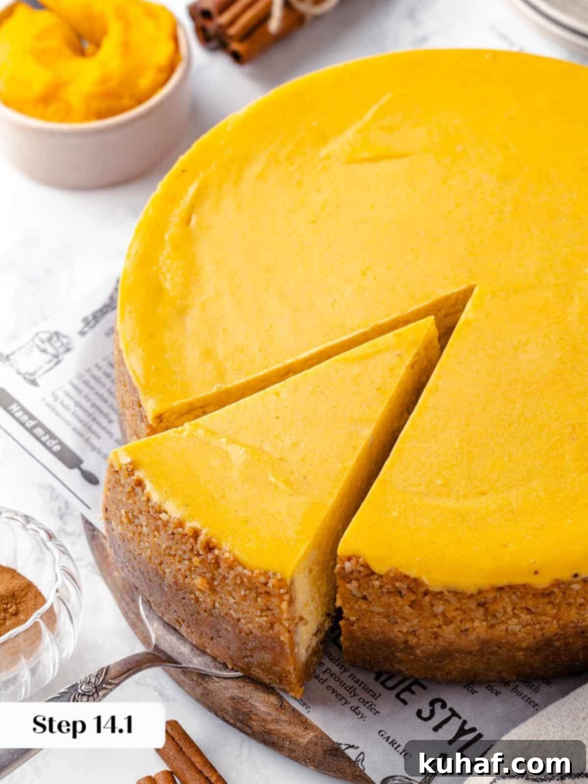 Decadent Pumpkin Cheesecake 20 A perfectly sliced pumpkin cheesecake, showcasing its smooth, creamy interior and crisp crust.