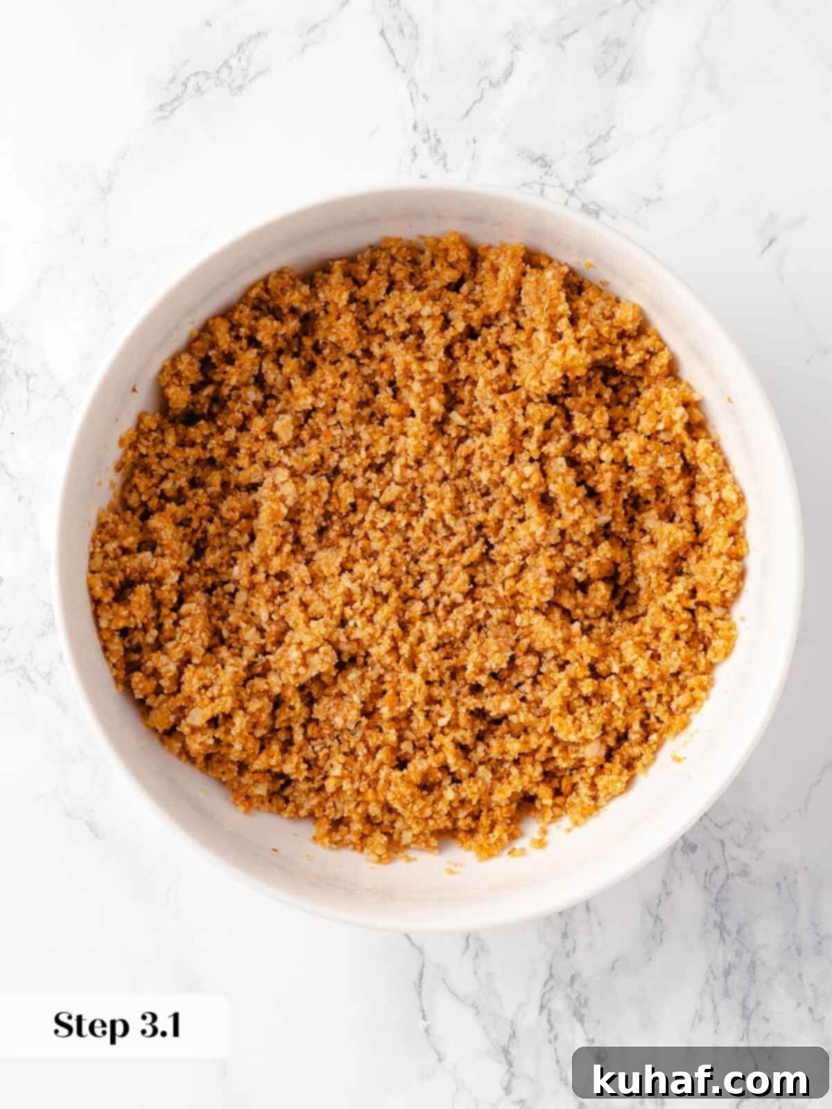 Decadent Pumpkin Cheesecake 5 Finely ground gingersnaps ready for the pumpkin cheesecake crust, showcasing their crumbly texture.