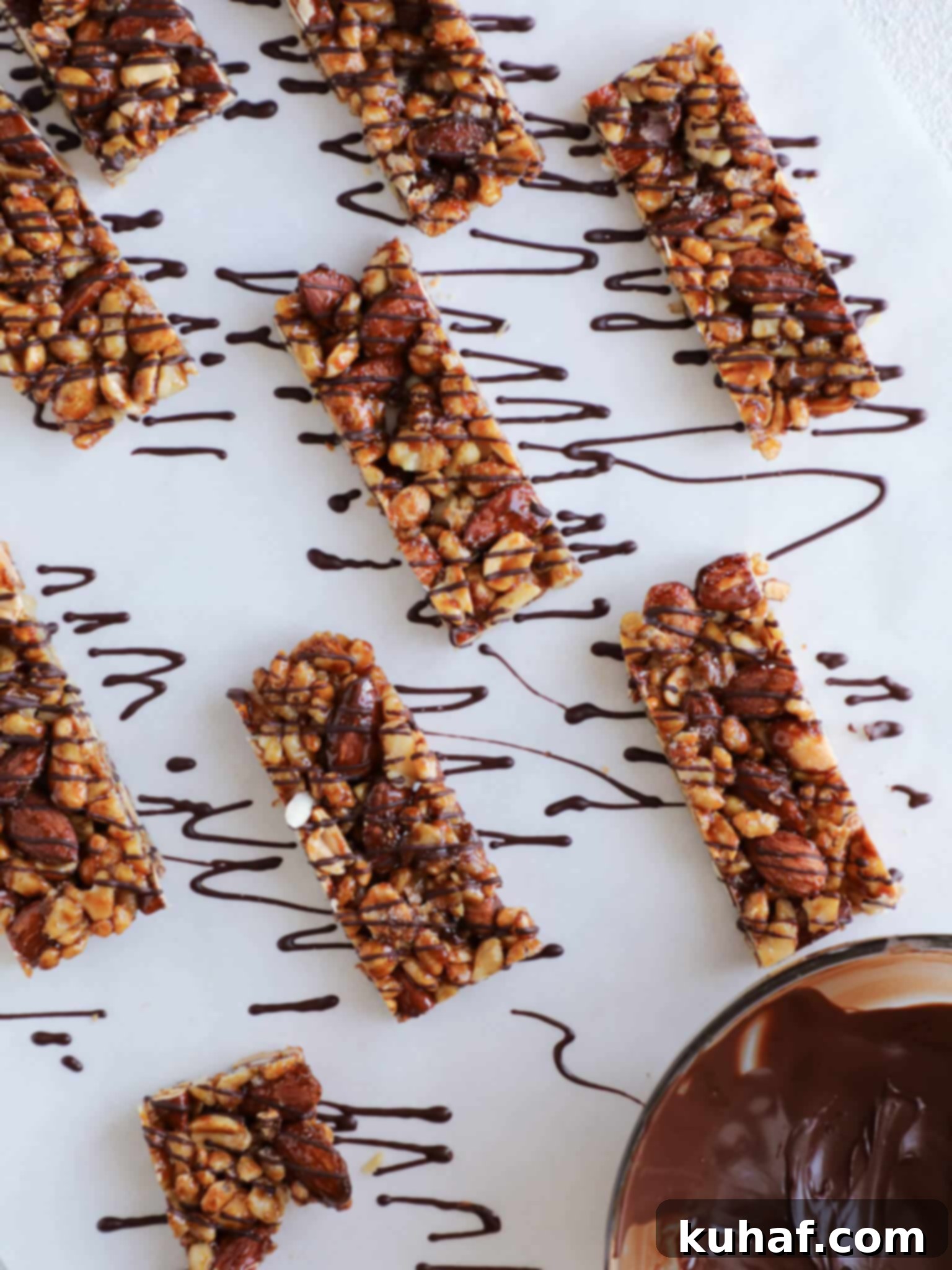 Homemade KIND Bars Copycat Recipe with a generous chocolate drizzle, showcasing a healthier alternative to commercial snack bars.
