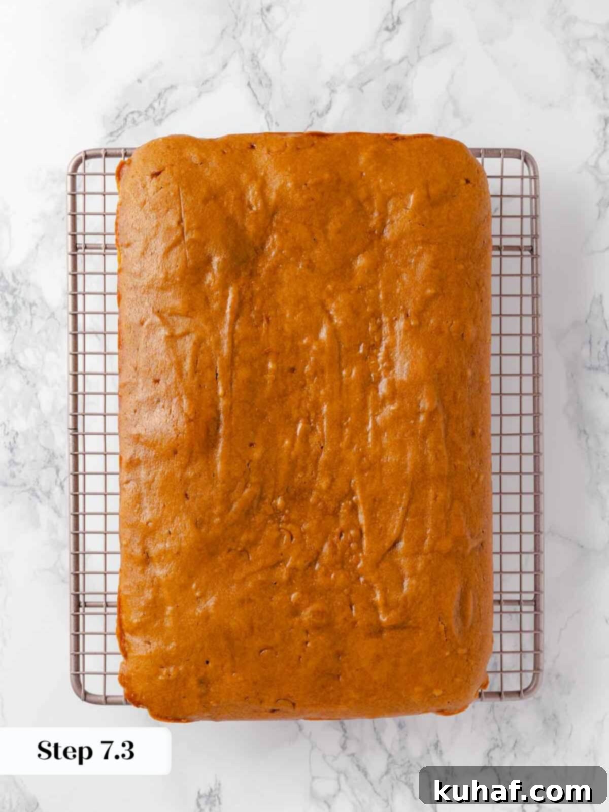 Delicious Autumn Pumpkin Squares 12 Baked pumpkin bars cooling on a metal rack.