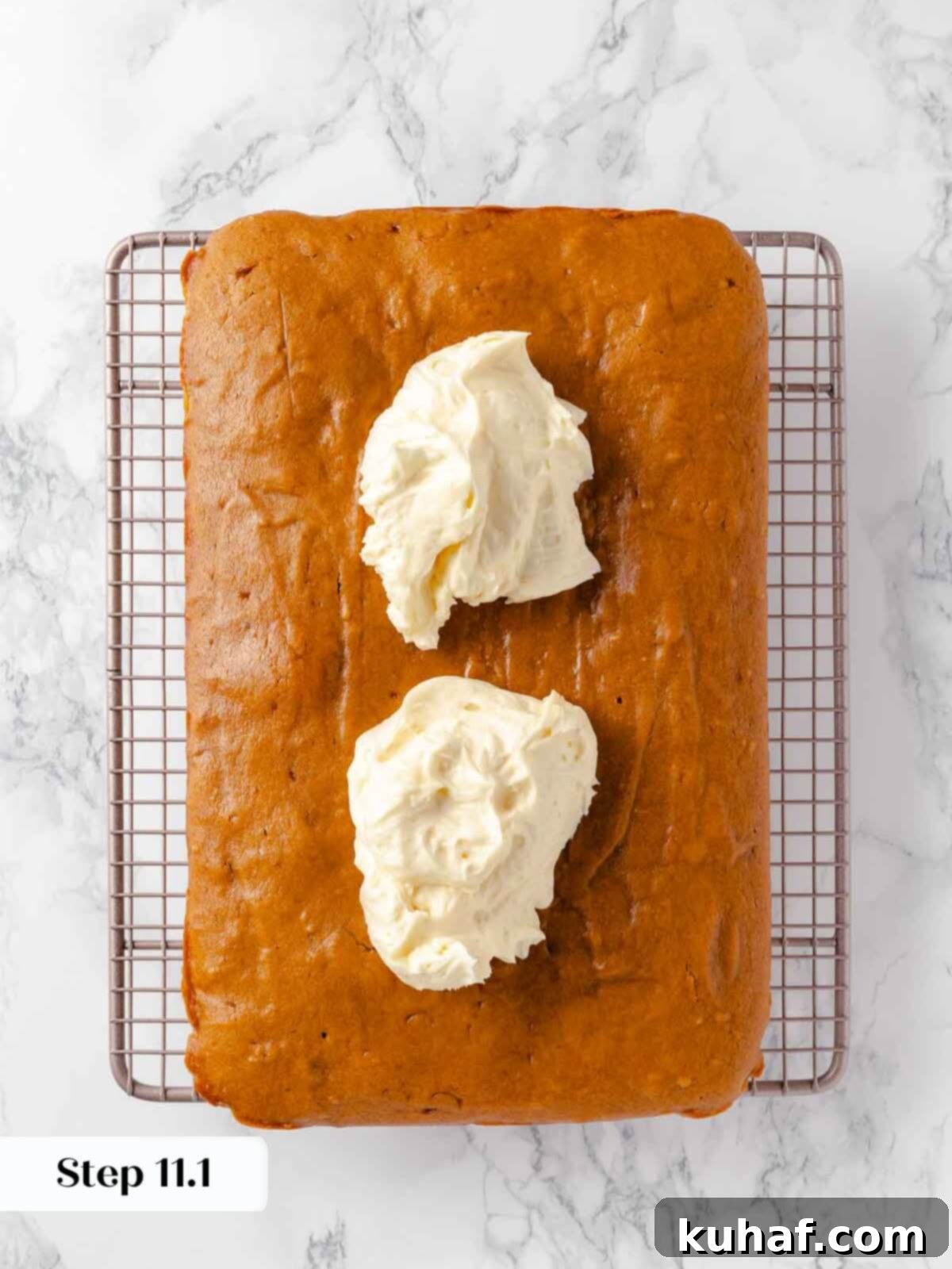 Delicious Autumn Pumpkin Squares 15 Dollops of frosting on top of pumpkin bars, ready to be spread.