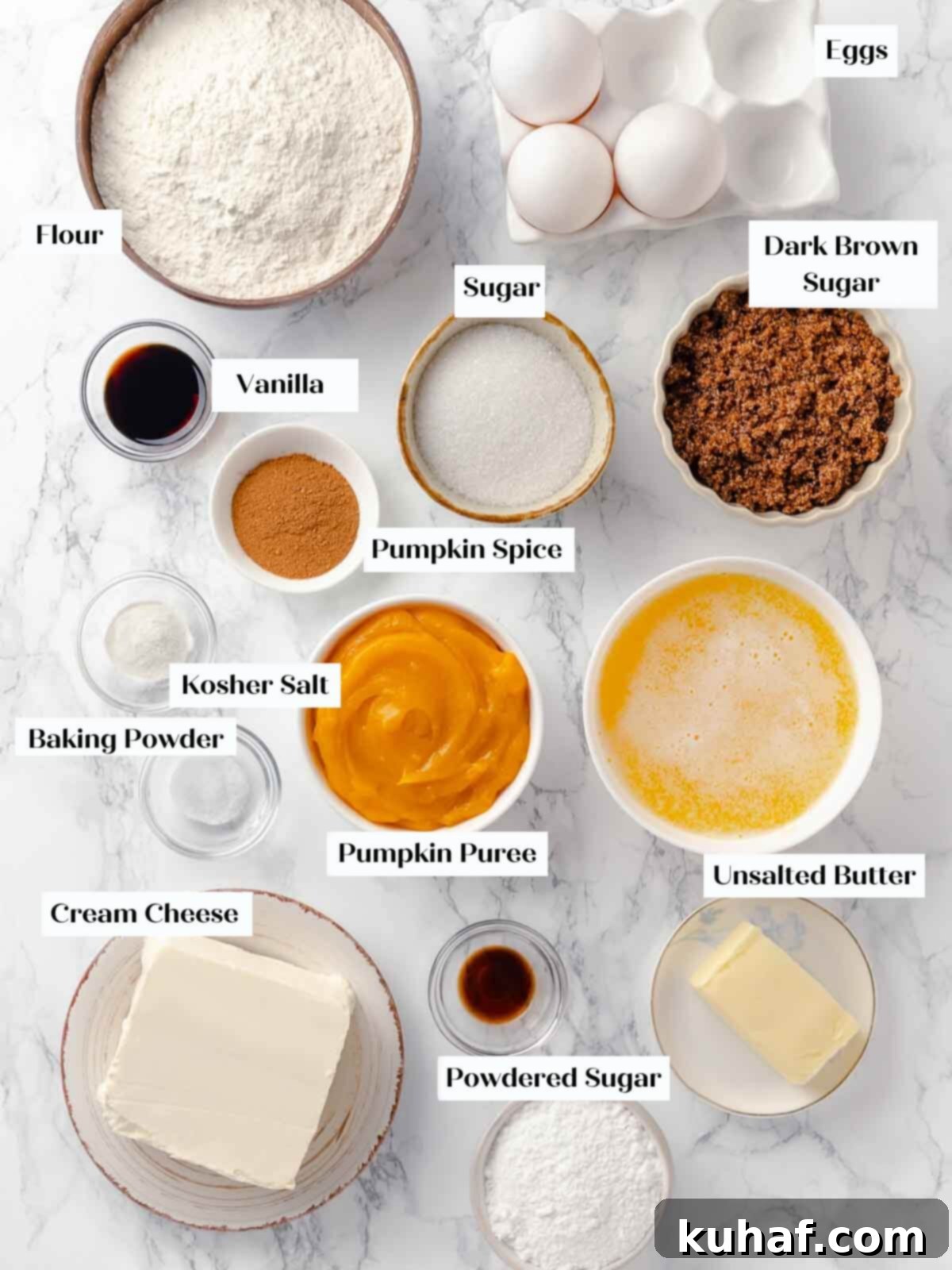 Delicious Autumn Pumpkin Squares 4 Ingredients for pumpkin bars laid out on a white marble surface.