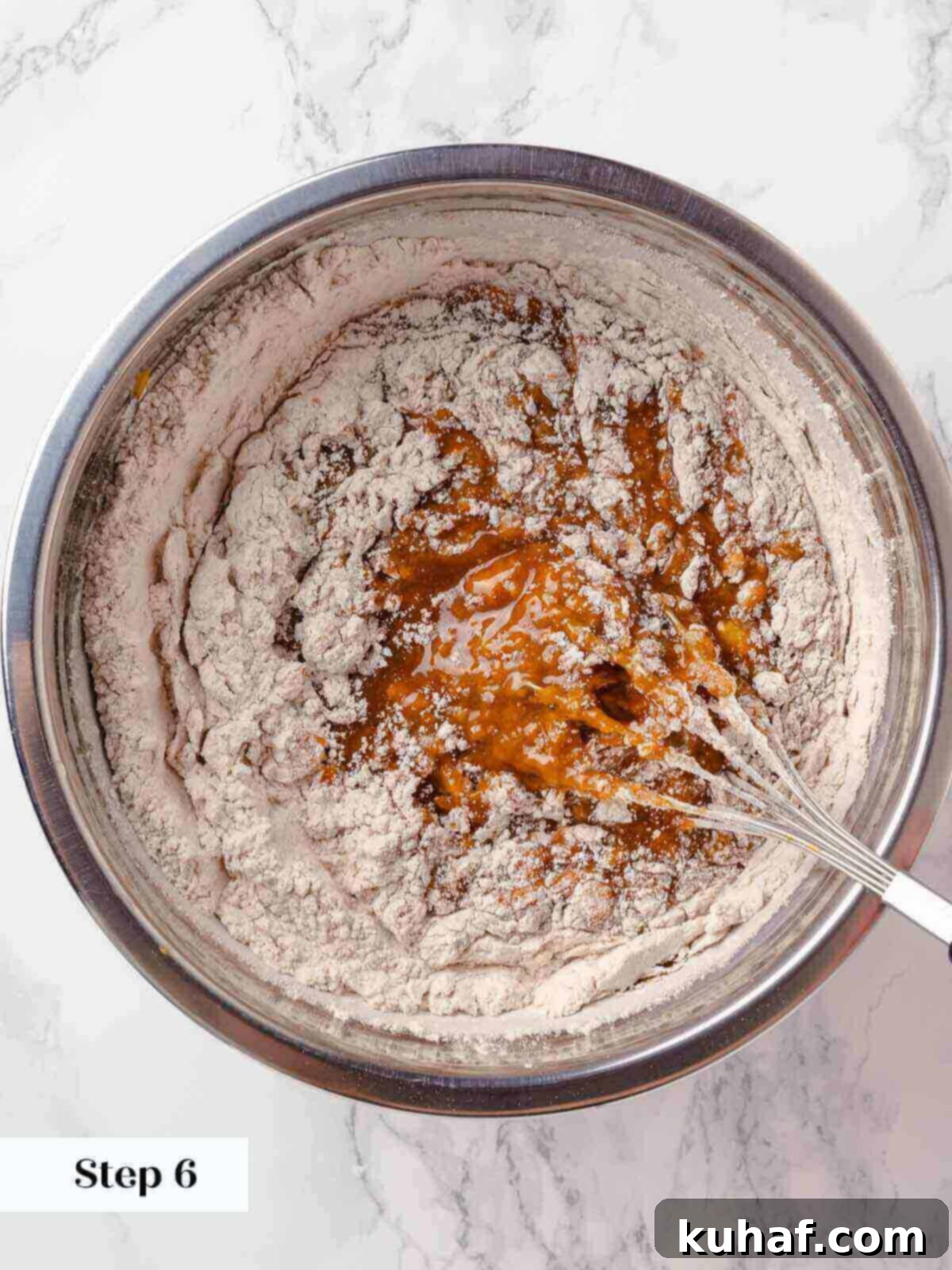 Delicious Autumn Pumpkin Squares 9 Wet and dry ingredients being mixed together for pumpkin bars.