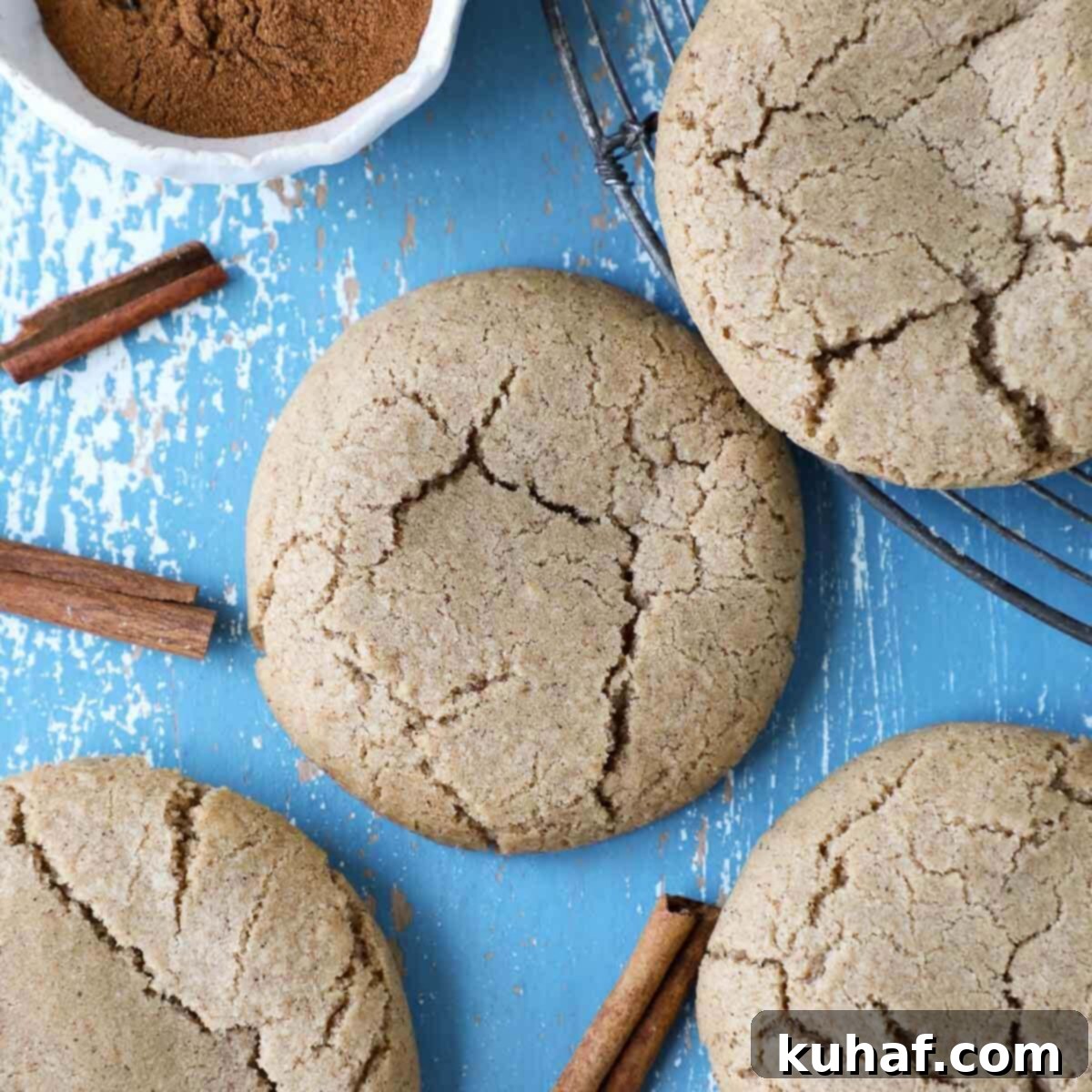 Warm Spiced Sugar Delights 3 Cinnamon sugar cookies with perfectly crackled tops, showcasing their soft texture