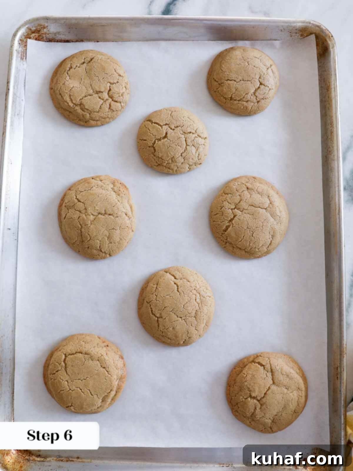 Warm Spiced Sugar Delights 8 Freshly baked cinnamon sugar cookies displayed on a baking tray