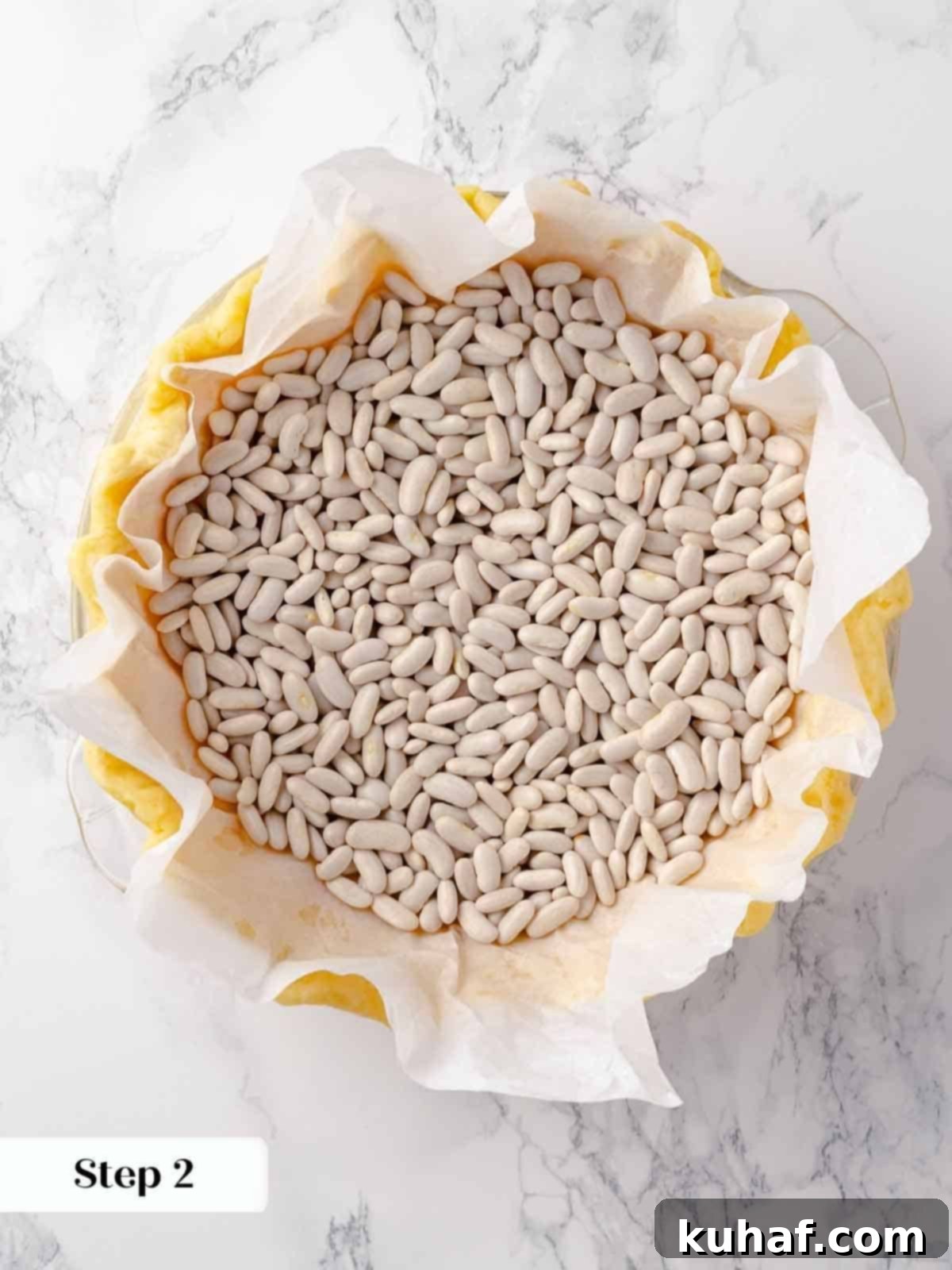 Pie weights meticulously placed inside the unbaked pie crust during the crucial par-baking process, ensuring the crust maintains its perfect shape.
