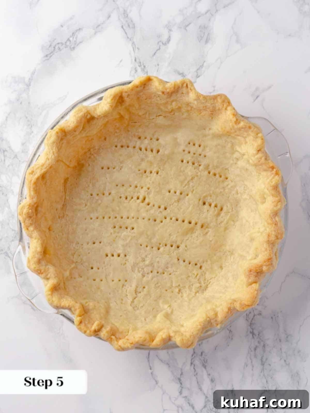 A perfectly golden brown, par-baked pie crust, boasting a wonderfully crisp texture and even color, now ready to be filled.