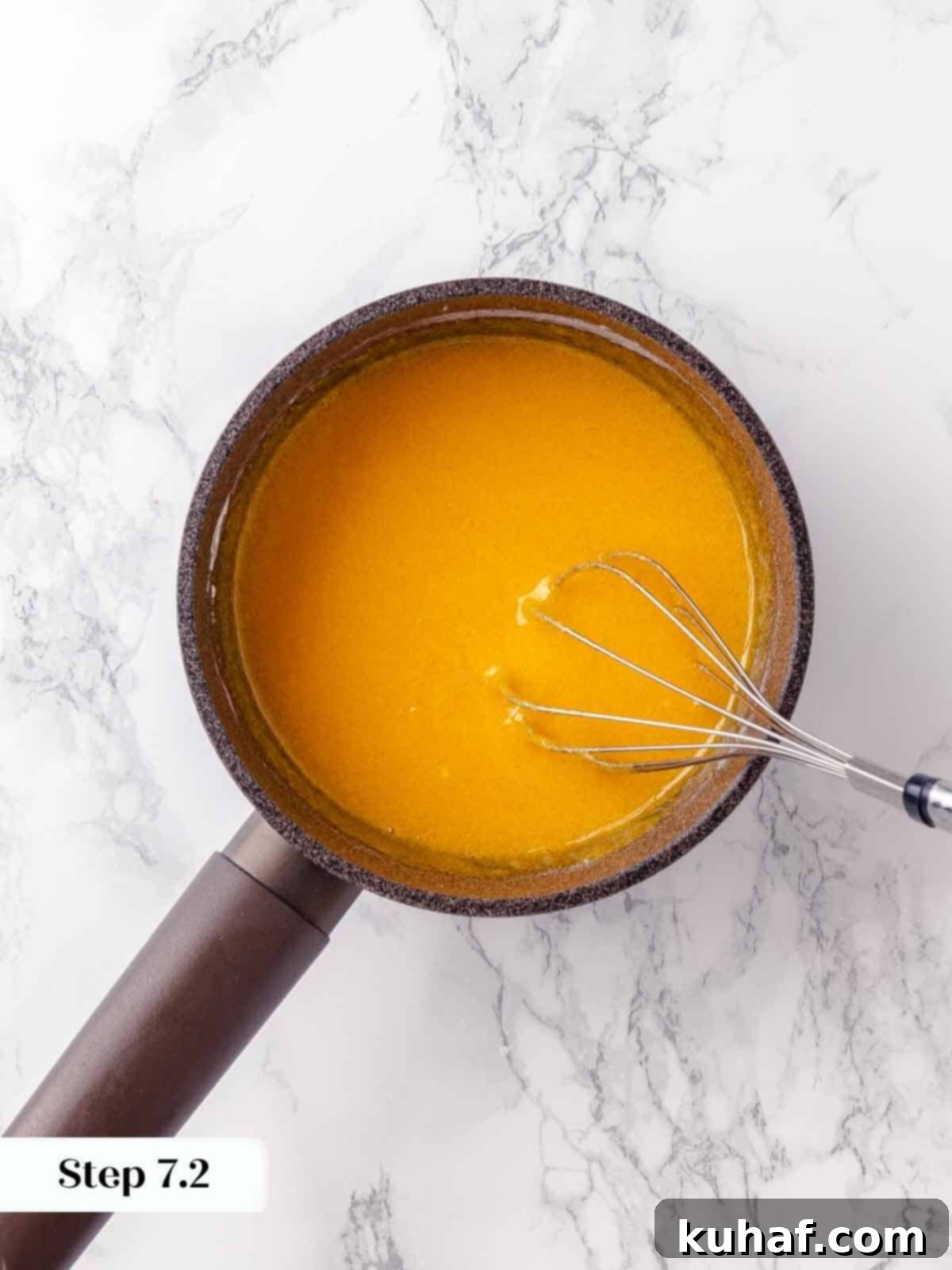 Smooth, pale yellow whisked egg yolks, perfectly prepared and ready to be mixed into the rich lemon filling for the pie.