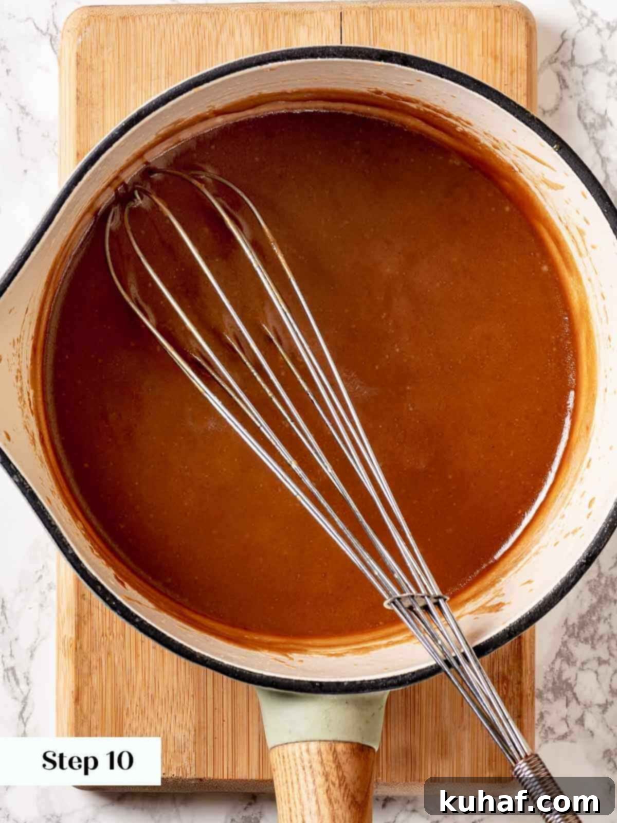 Toffee sauce being cooked in a saucepan.