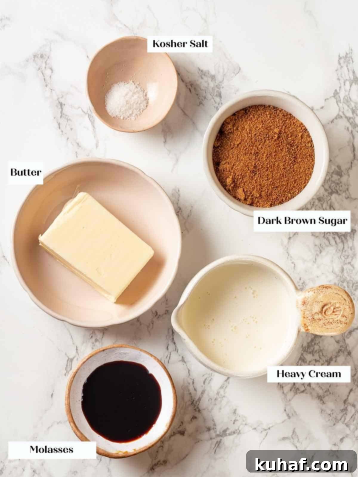 Ingredients for toffee sauce displayed on a white marble surface.
