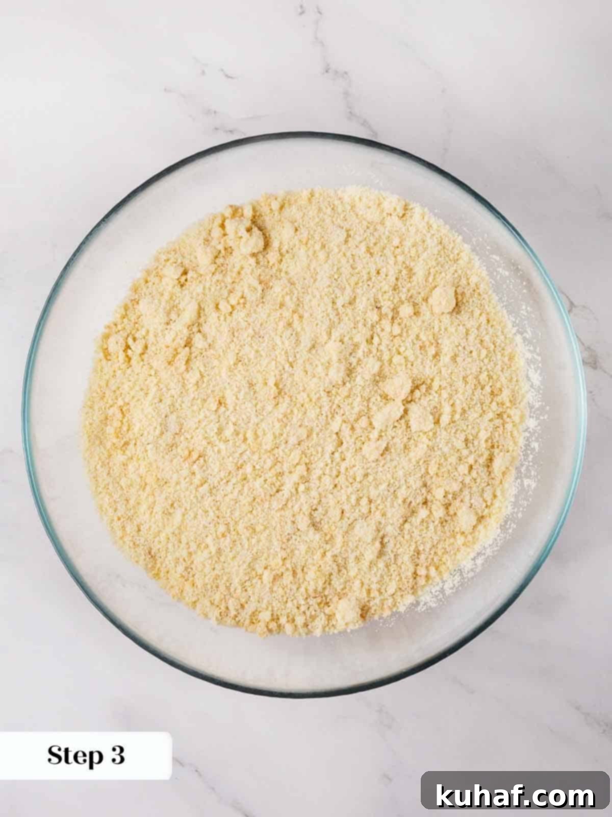 Classic Amaretti Cookies 6 Step-by-step image showing the process of folding egg whites into the almond mixture.