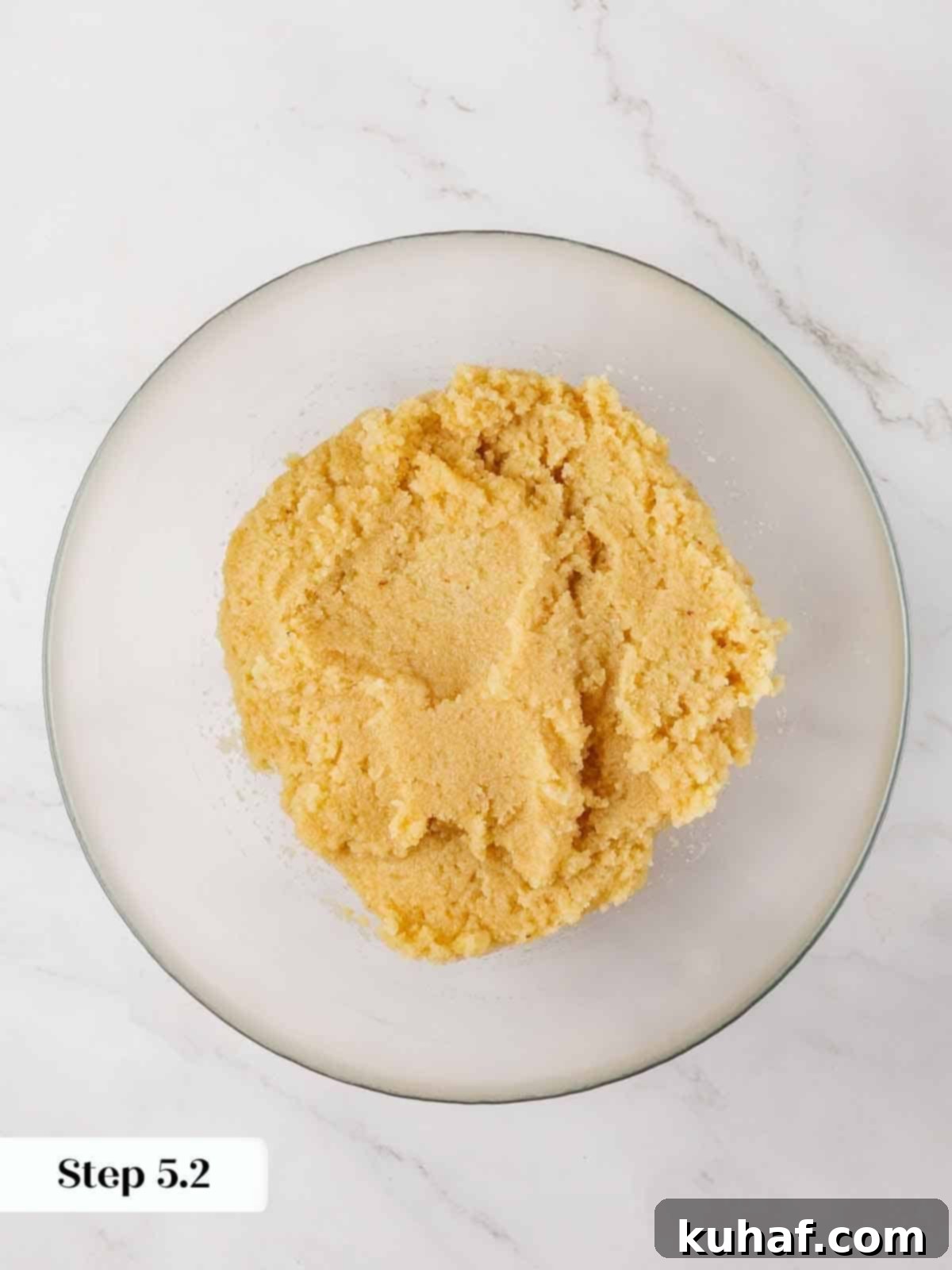 Classic Amaretti Cookies 8 Step-by-step image showing cookie dough being scooped.