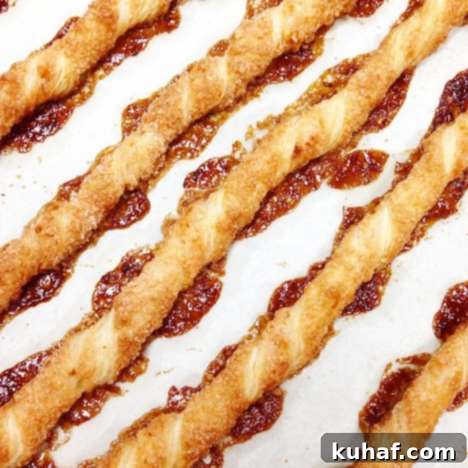 Sacristans, twisted puff pastry sticks coated with sugar and chopped almonds, perfectly baked to a golden crisp.
