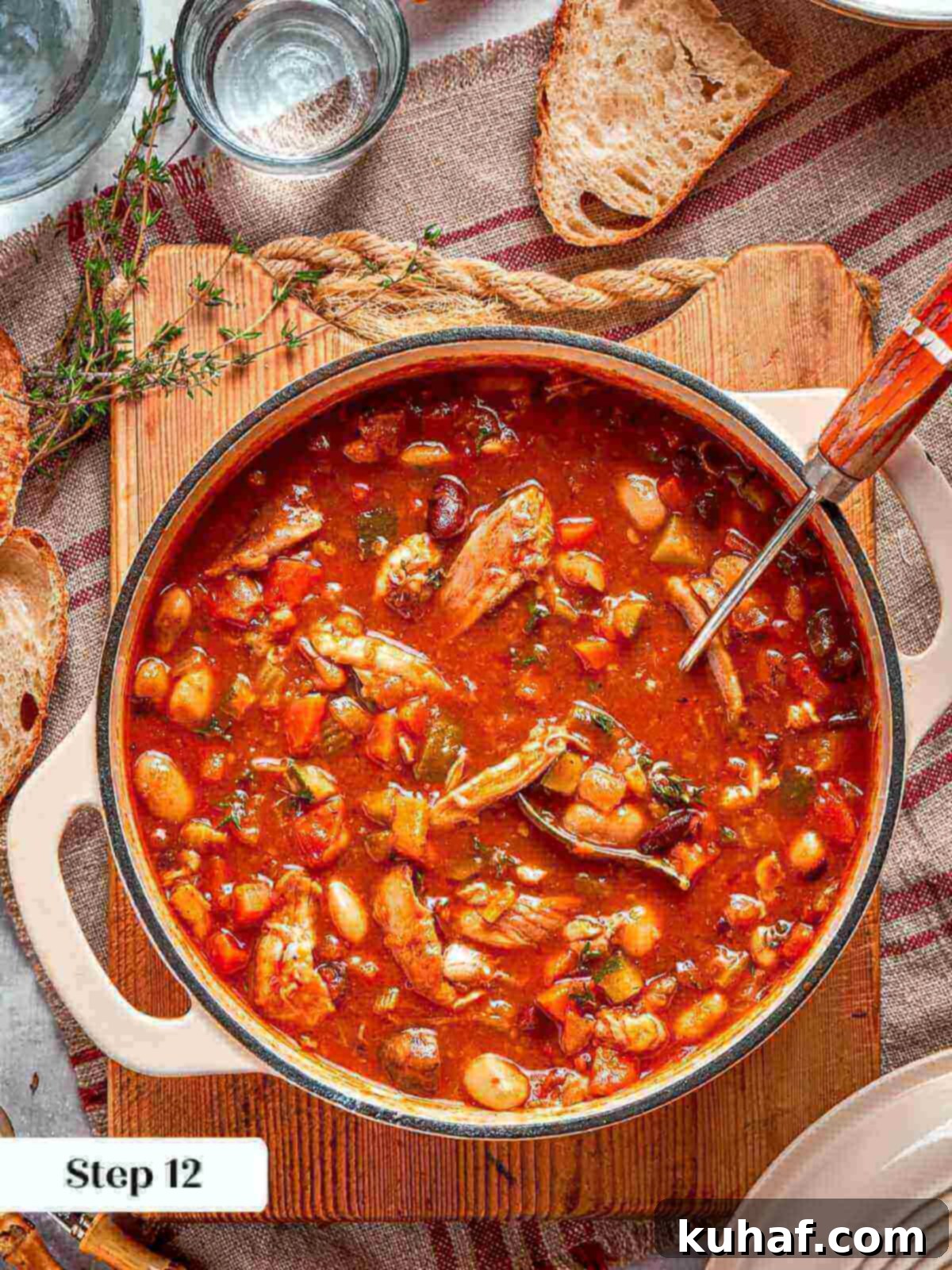 Comforting Chicken Garden Soup 16 A fully cooked, rich, and vibrant chicken vegetable soup simmering in a pot.
