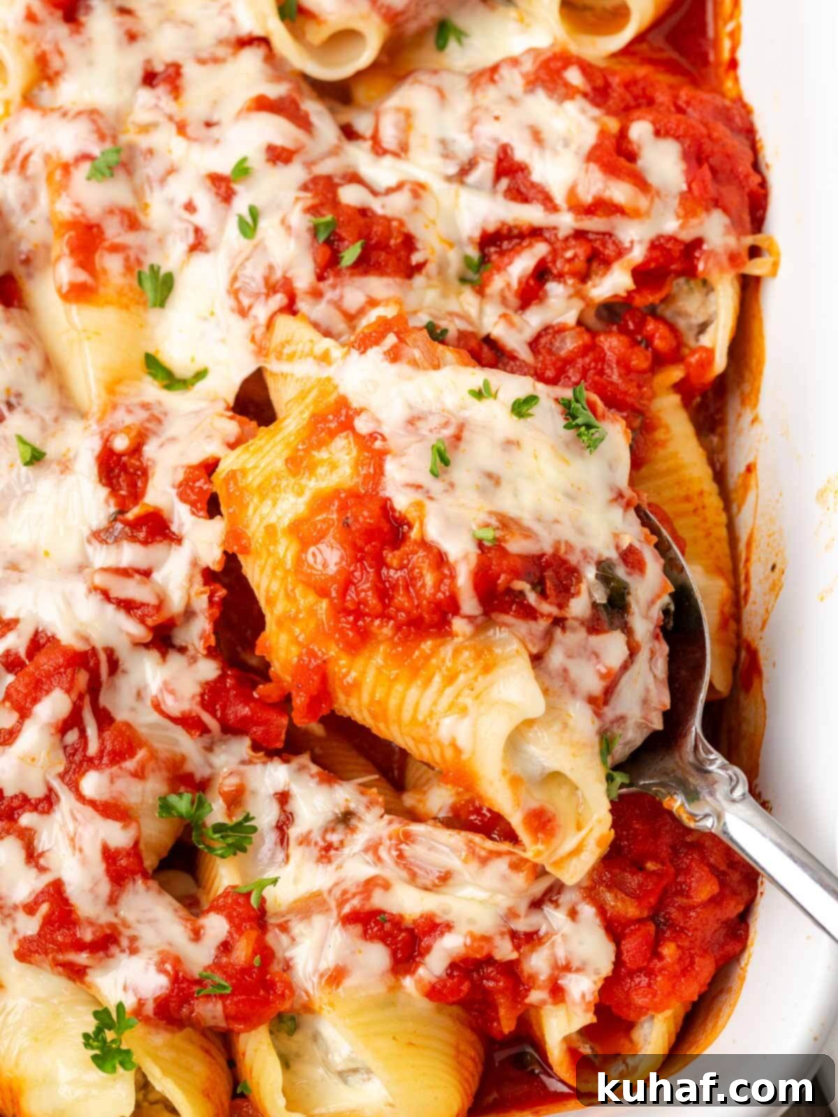 stuffed shells with ground beef in casserole.
