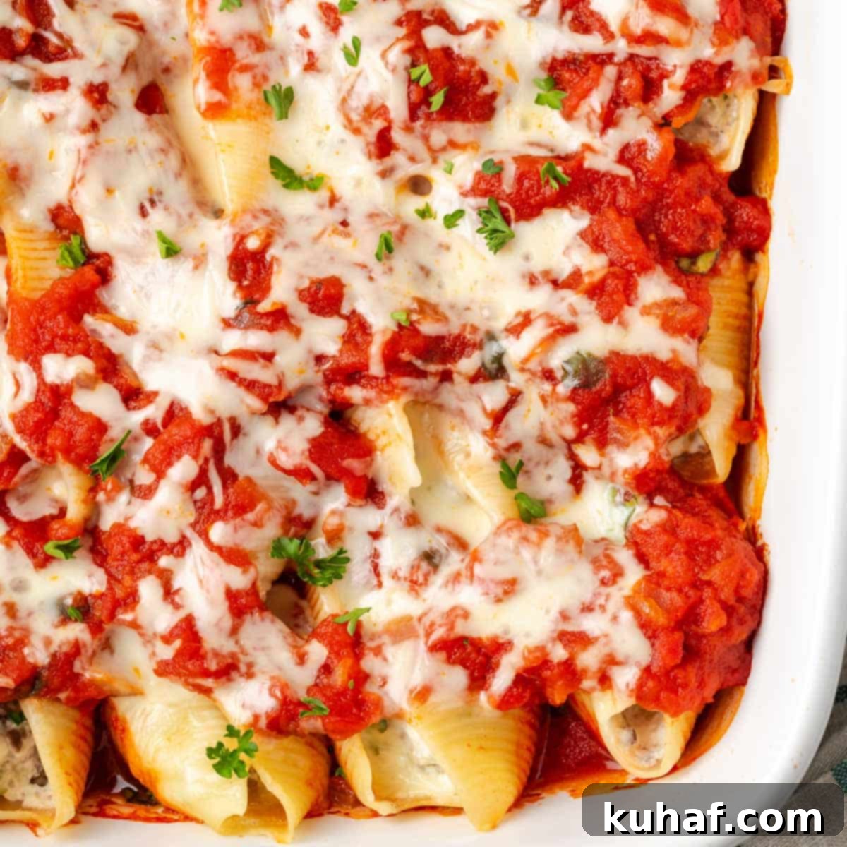 baked stuffed shells in dish.