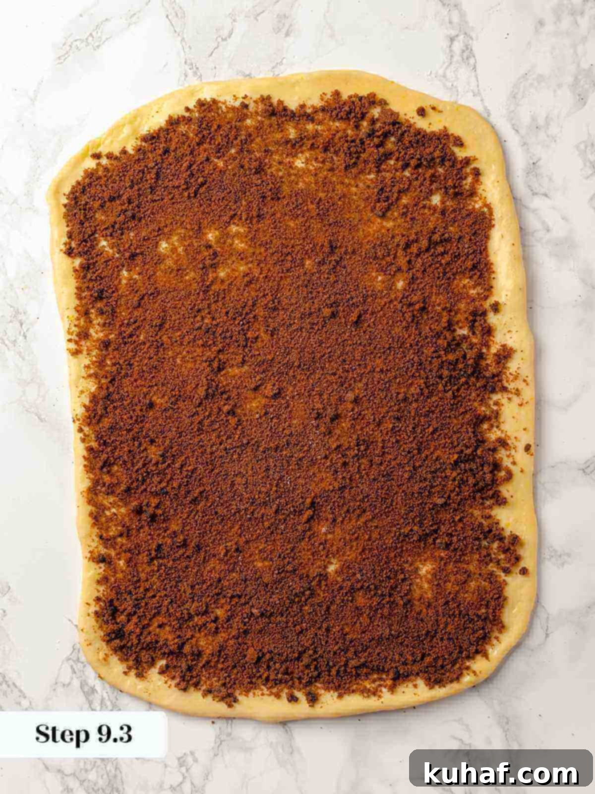 Dough brushed with butter and sprinkled with cinnamon sugar.