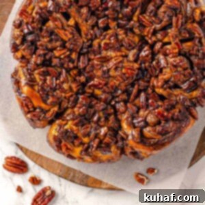 Whole pecans scattered on a caramelized surface after baking.