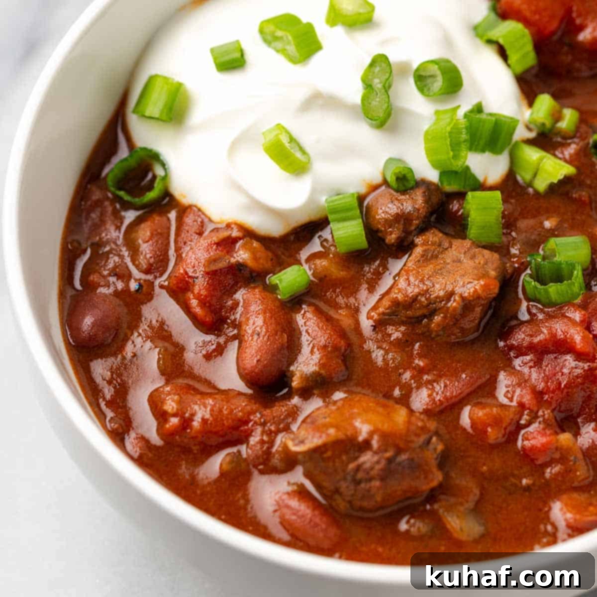 steak chili in white bowl.