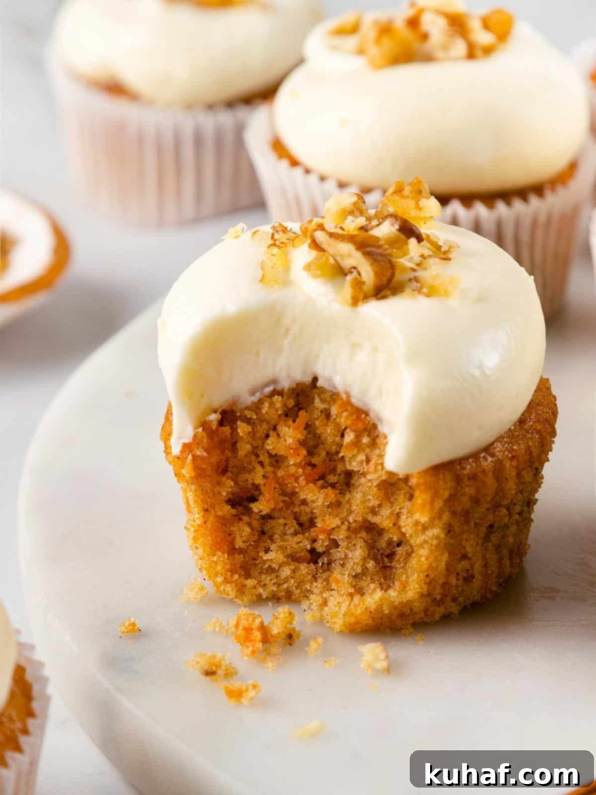 Spiced Carrot Cupcake Bliss 2 Perfectly frosted carrot cake cupcakes with toasted walnuts