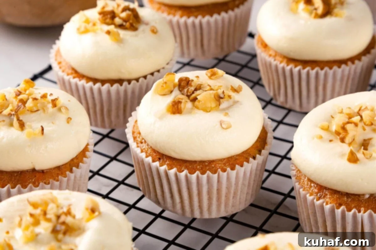Spiced Carrot Cupcake Bliss 3 A pair of beautifully frosted carrot cake cupcakes