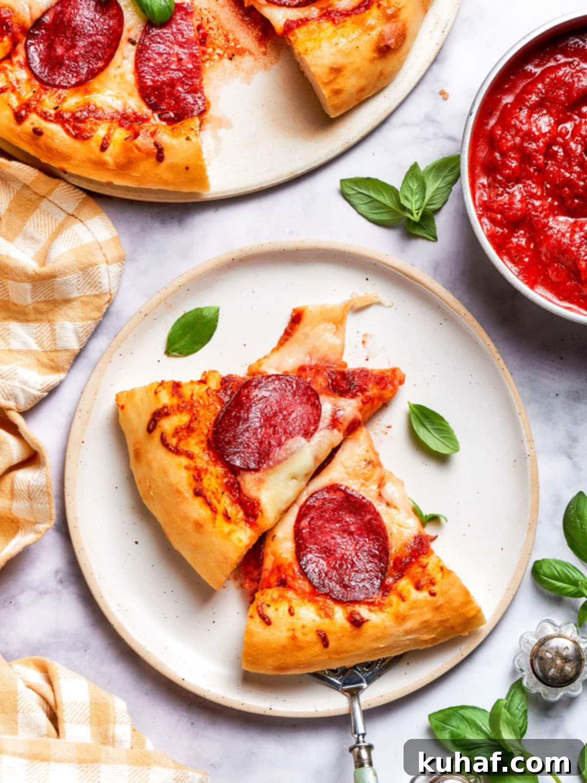 A pair of pizza slices with melted cheese and crispy crusts.