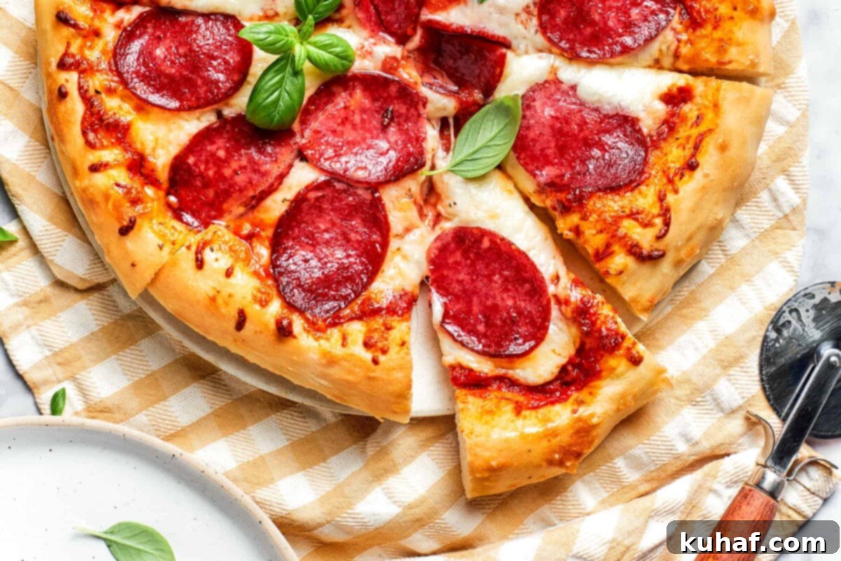 Close-up of crisp, golden-brown pizza crust edge.