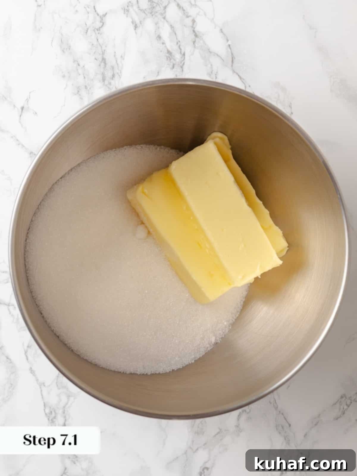 Room temperature butter and granulated sugar prepared to be creamed in a stand mixer until light and fluffy.