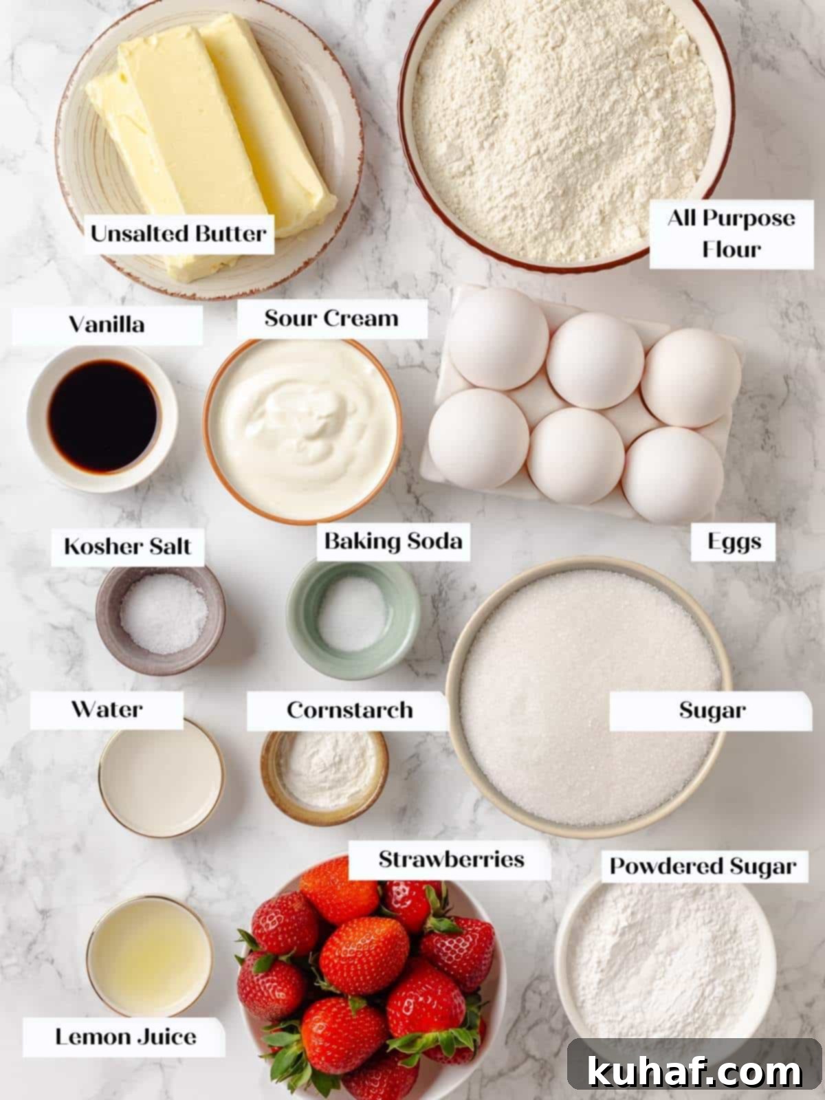 All ingredients for strawberry pound cake measured and arranged neatly on a kitchen counter, ready for baking.