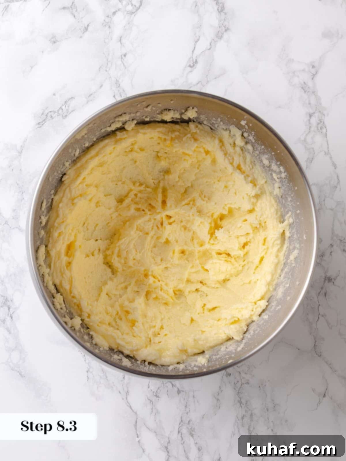 Egg is mixed into the creamed butter and sugar, creating structure for the batter.