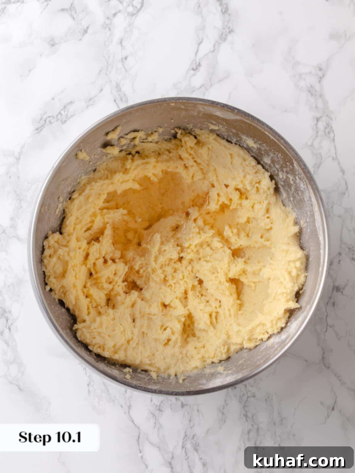 Syrup mixture poured into the topping batter adds moisture and sweetness before mixing.