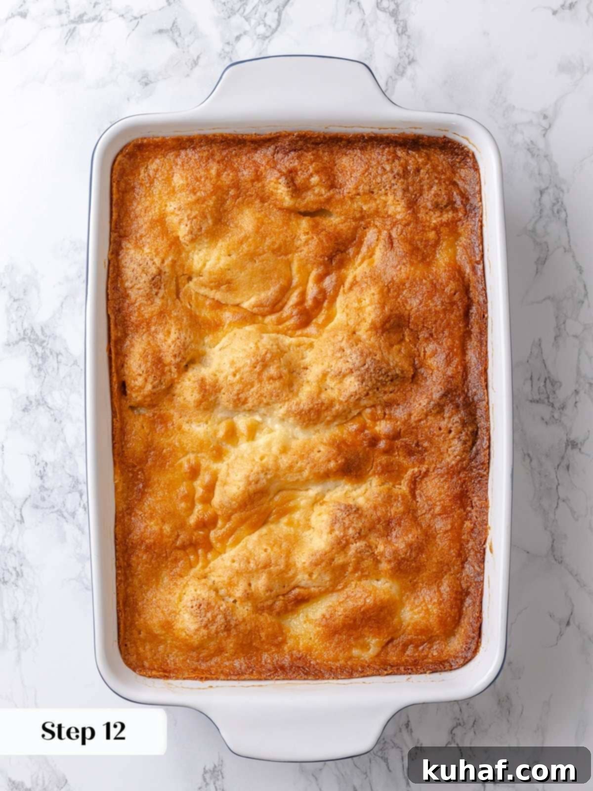 Finished gooey butter cake baked to golden brown with puffed edges and soft center.