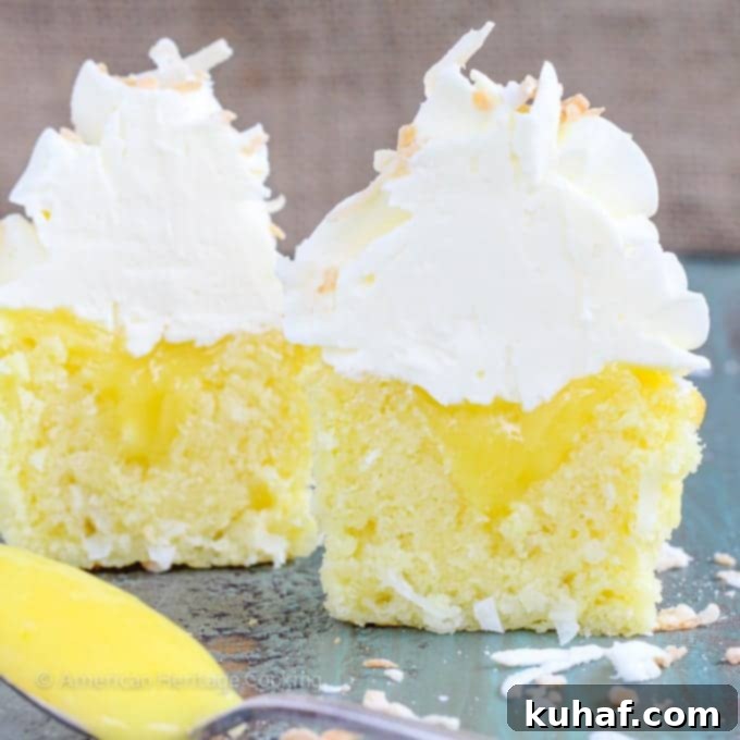 In these Lemon Coconut Cupcakes a moist coconut cupcake that is made with both dried coconut and coconut milk is filled with lemon curd and then topped with a coconut Italian Meringue Buttercream.  And then topped off with some more toasted coconut.
