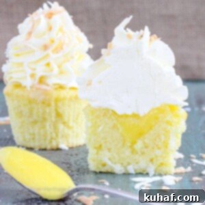 In these Lemon Coconut Cupcakes a moist coconut cupcake that is made with both dried coconut and coconut milk is filled with lemon curd and then topped with a coconut Italian Meringue Buttercream. And then topped off with some more toasted coconut.