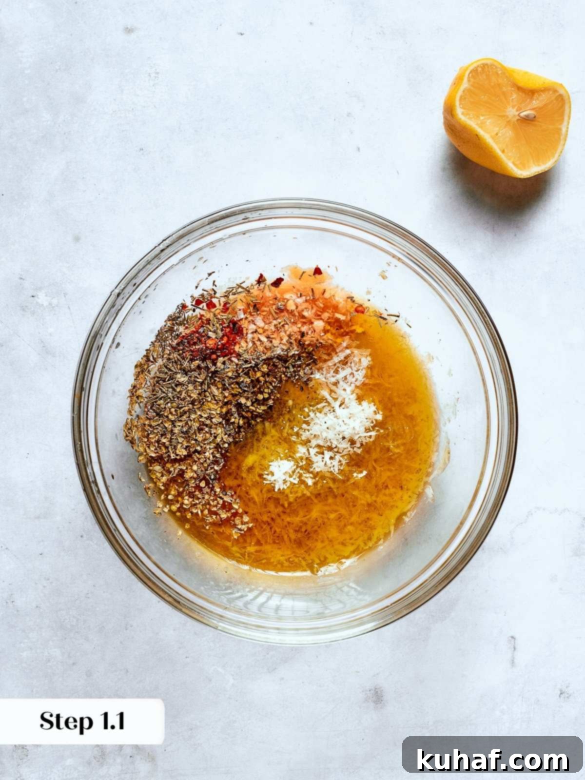 Jar filled with fresh Italian salad dressing ingredients including olive oil, vinegar, and herbs, arranged on a rustic wooden surface.