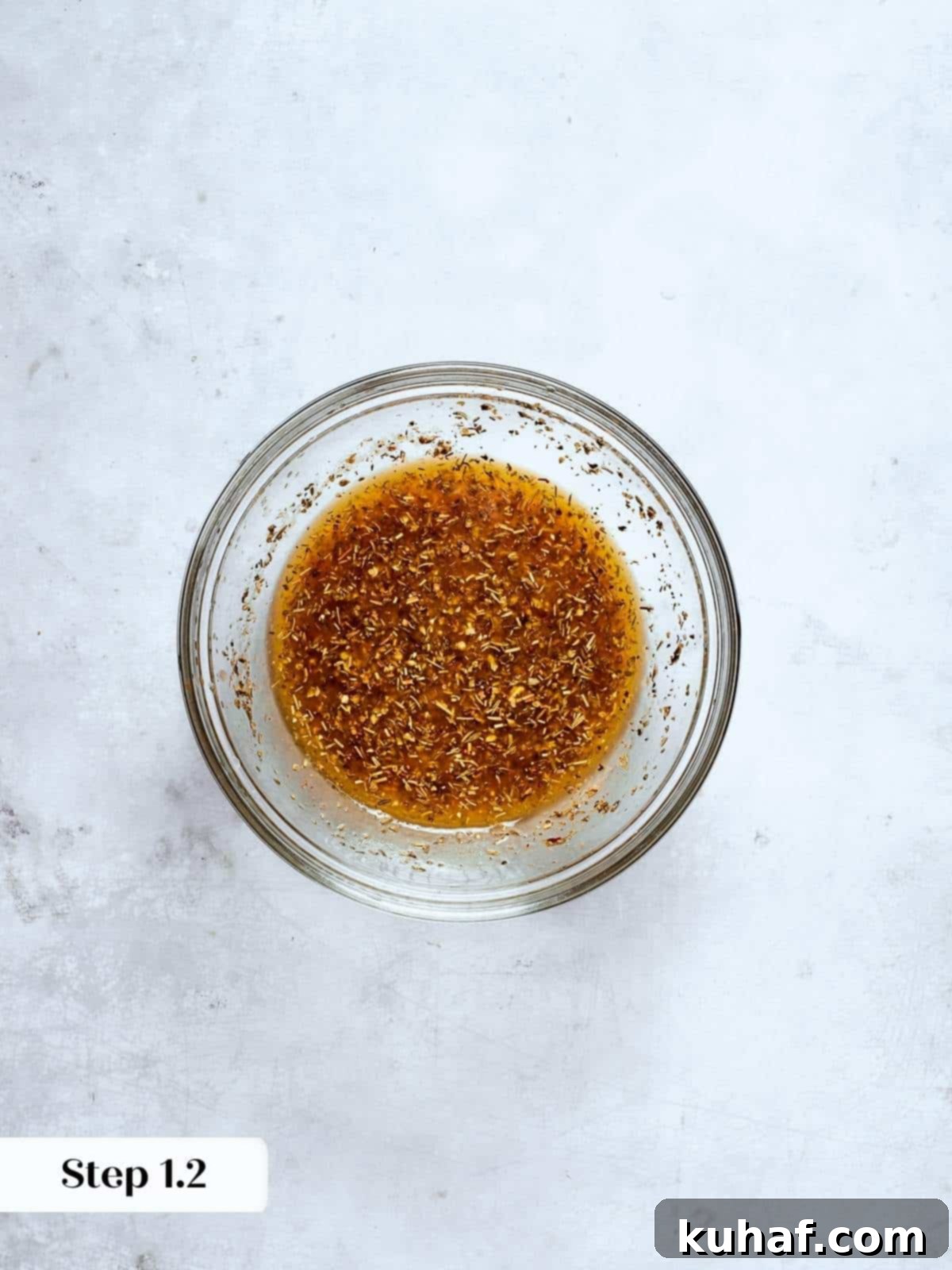 Italian salad dressing ingredients combined in a jar, ready for vigorous mixing and flavor development.