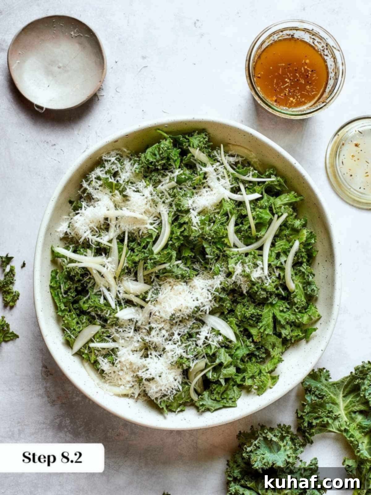 Fresh parmesan cheese added to Tuscan kale salad for a salty, rich finishing flavor.