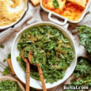 Tuscan kale salad served with wooden spoons, topped with parmesan and golden breadcrumb crunchies.