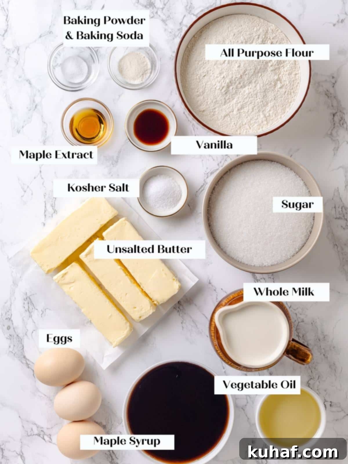 Pure Maple Indulgence 3 Arrangement of baking ingredients including flour, eggs, maple syrup, and oil on a kitchen counter, ready for maple cake preparation.