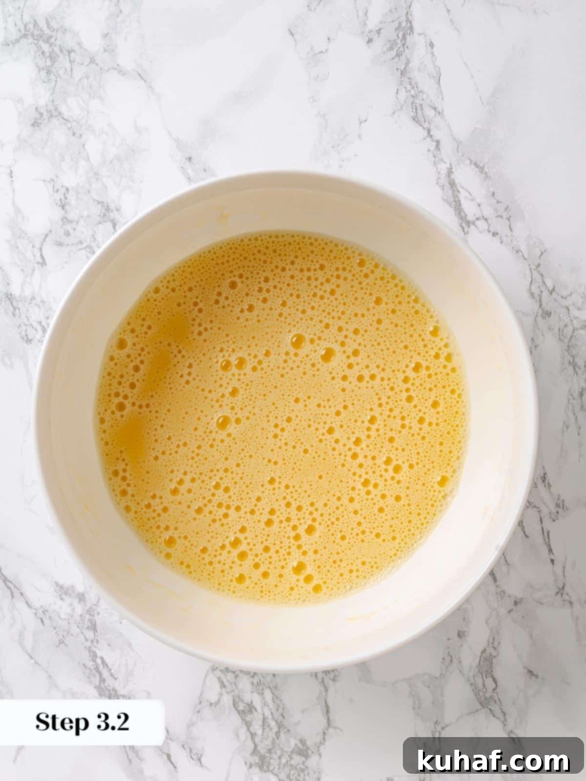 Pure Maple Indulgence 7 Whisked eggs and oil mixture, perfectly emulsified and smooth, forming the wet base for the maple cake batter.