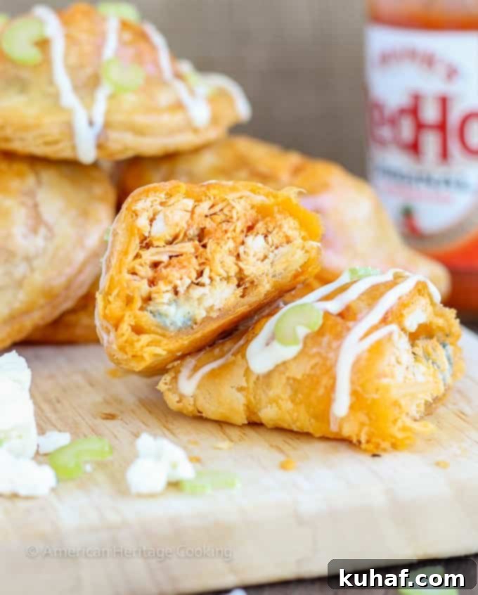 A trio of freshly baked Buffalo Chicken Blue Cheese Hand Pies, showcasing their perfect golden crust.
