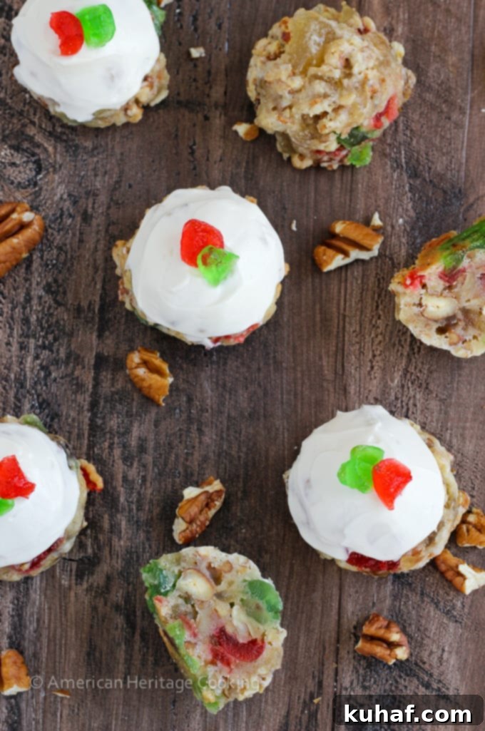 Fruitcake Cookies are chewy sugar cookies stuffed full of candied fruits, raisins and toasted pecans for a unique twist on the classic Christmas fruitcake! Topped with a brandy cream cheese frosting, these little cookies are irresistible! 