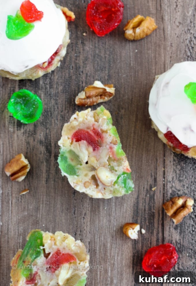 Fruitcake Cookies are chewy sugar cookies stuffed full of candied fruits, raisins and toasted pecans for a unique twist on the classic Christmas fruitcake! Topped with a brandy cream cheese frosting, these little cookies are irresistible! 